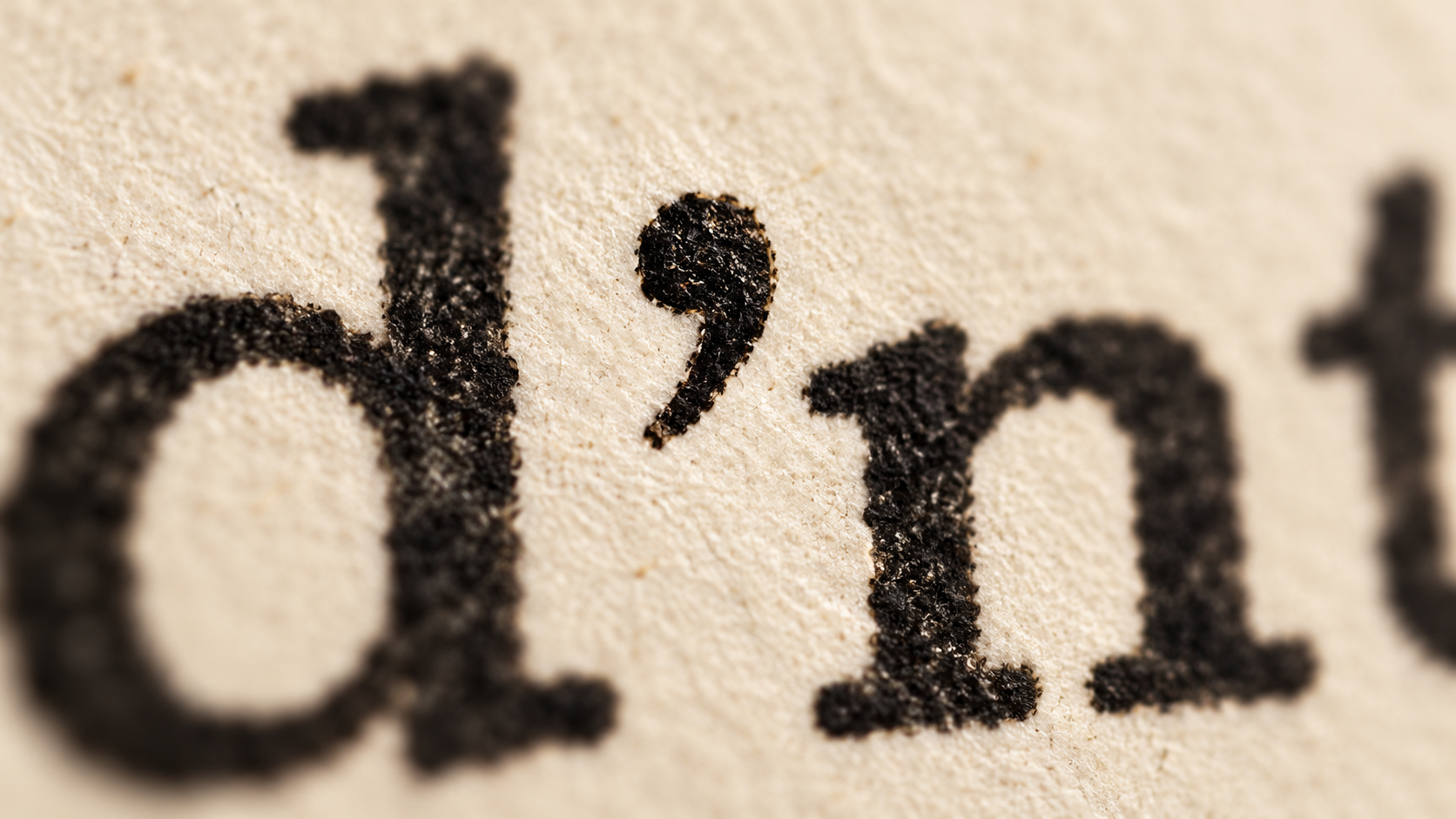 Extreme close-up of the apostrophe in a typed word.
